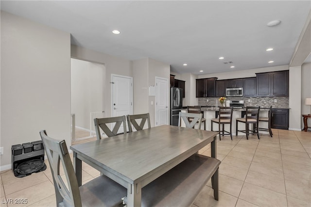 9950 Coyote Echo Ct, Las Vegas, NV 89166 - dining area with light tile patterned floors and recessed lighting