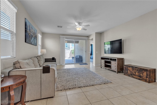 9950 Coyote Echo Ct, Las Vegas, NV 89166 - living room with light tile patterned floors and ceiling fan