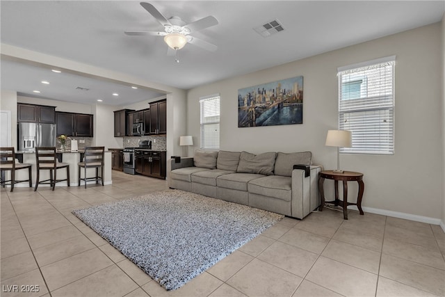 9950 Coyote Echo Ct, Las Vegas, NV 89166 - living room featuring ceiling fan, light tile patterned flooring, and recessed lighting