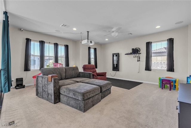 9950 Coyote Echo Ct, Las Vegas, NV 89166 - living room featuring carpet, a ceiling fan, healthy amount of natural light, and recessed lighting