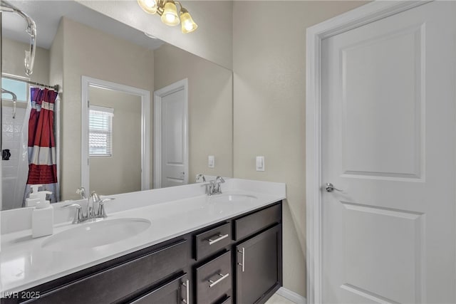 9950 Coyote Echo Ct, Las Vegas, NV 89166 - bathroom featuring double vanity and a shower with curtain