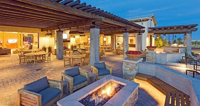 9950 Coyote Echo Ct, Las Vegas, NV 89166 - view of patio featuring an outdoor living space with a fire pit and a pergola