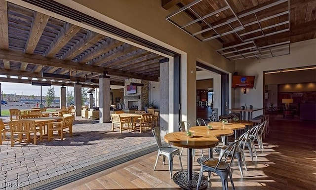 9950 Coyote Echo Ct, Las Vegas, NV 89166 - dining area featuring a wood ceiling with exposed beams and hardwood / wood-style floors