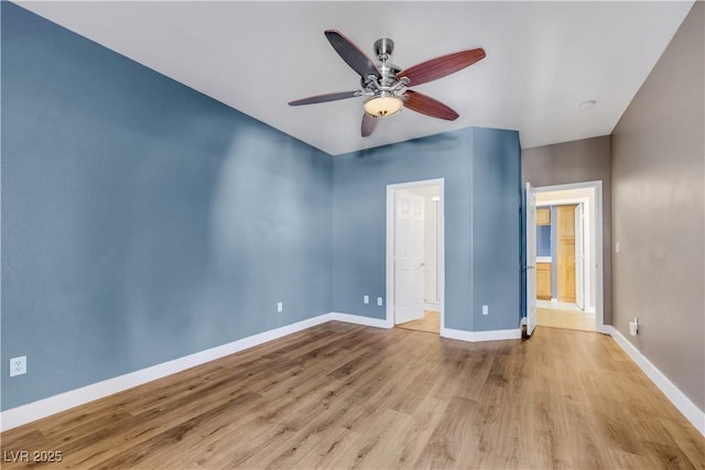 108 Lemon Glaze St Unit 202, Las Vegas, NV 89145 - unfurnished bedroom with wood finished floors, baseboards, a ceiling fan, and ensuite bathroom
