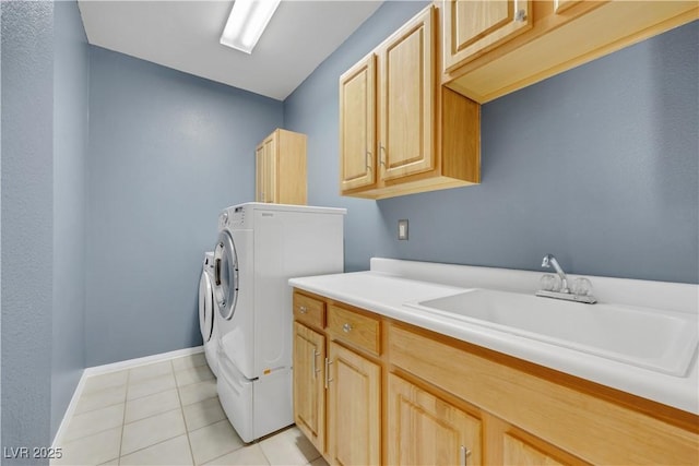 108 Lemon Glaze St Unit 202, Las Vegas, NV 89145 - laundry area featuring cabinet space, light tile patterned flooring, baseboards, and separate washer and dryer