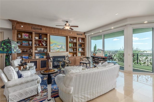 9101 Alta Dr Unit 203, Las Vegas, NV 89145 - living room featuring ceiling fan, a glass covered fireplace, tile patterned floors, and recessed lighting