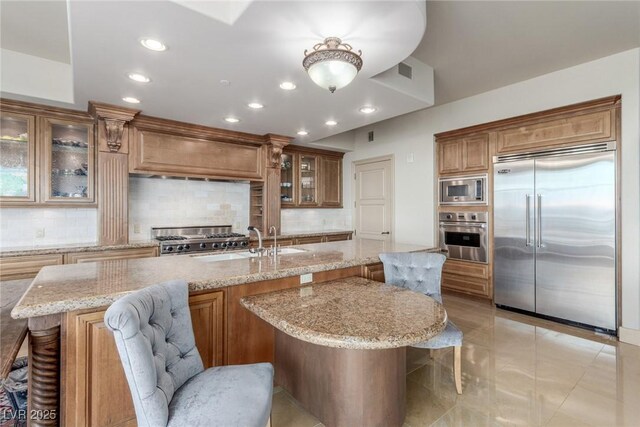 9101 Alta Dr Unit 203, Las Vegas, NV 89145 - kitchen featuring built in appliances, a sink, backsplash, and recessed lighting
