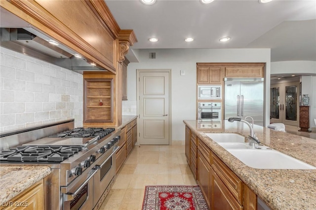 9101 Alta Dr Unit 203, Las Vegas, NV 89145 - kitchen with built in appliances, premium range hood, a sink, tasteful backsplash, and recessed lighting