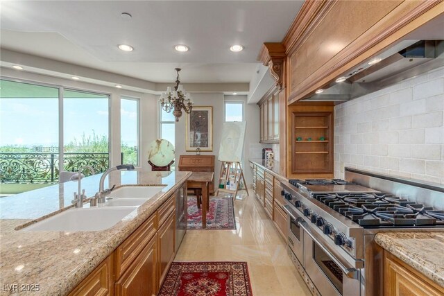 9101 Alta Dr Unit 203, Las Vegas, NV 89145 - kitchen with double oven range, a sink, custom exhaust hood, light stone counters, and a chandelier