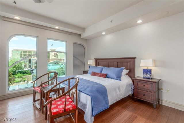 9101 Alta Dr Unit 203, Las Vegas, NV 89145 - bedroom with multiple windows, wood finished floors, recessed lighting, and baseboards