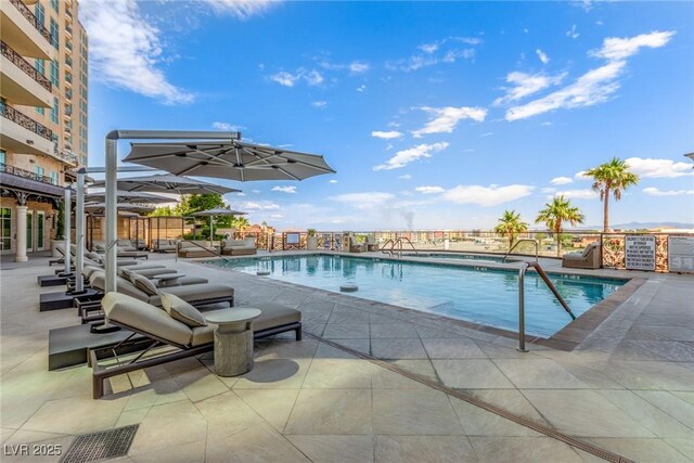 9101 Alta Dr Unit 203, Las Vegas, NV 89145 - community pool with a patio area