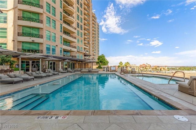 9101 Alta Dr Unit 203, Las Vegas, NV 89145 - community pool featuring a patio and an outdoor hangout area