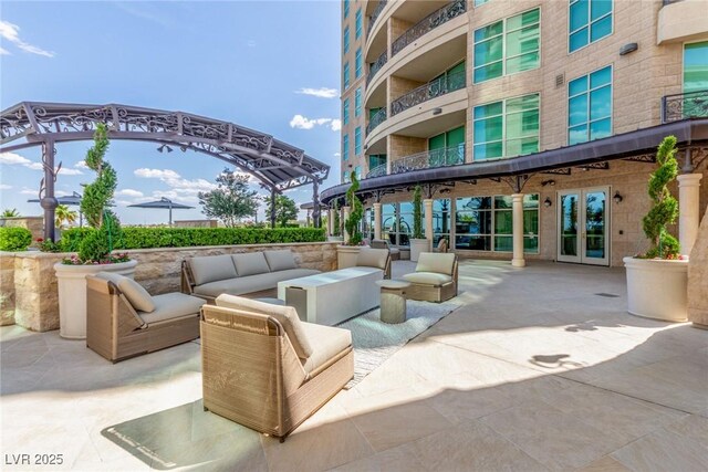 9101 Alta Dr Unit 203, Las Vegas, NV 89145 - view of home's community featuring outdoor lounge area and a patio area