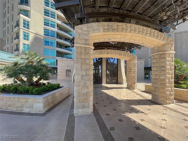 9101 Alta Dr Unit 203, Las Vegas, NV 89145 - doorway to property with stone siding