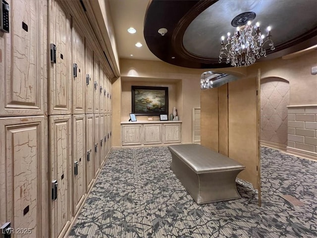 9101 Alta Dr Unit 203, Las Vegas, NV 89145 - corridor featuring carpet flooring, recessed lighting, arched walkways, and a chandelier