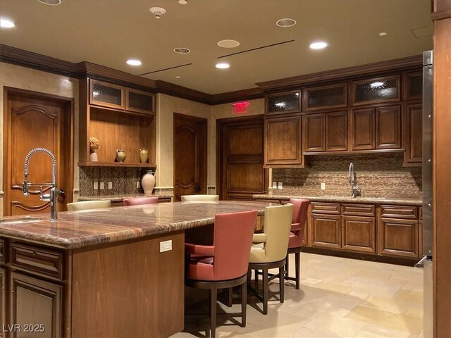 9101 Alta Dr Unit 203, Las Vegas, NV 89145 - bar featuring crown molding, a sink, tasteful backsplash, and recessed lighting