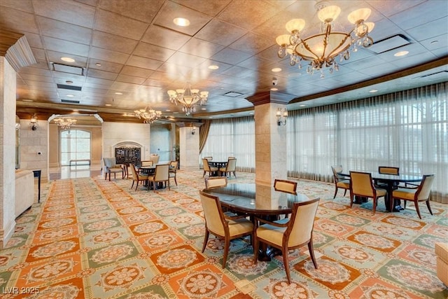 9101 Alta Dr Unit 203, Las Vegas, NV 89145 - dining room featuring a chandelier, plenty of natural light, and ornate columns