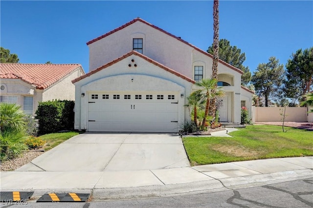 9333 Dry Dock Dr, Las Vegas, NV 89117 - mediterranean / spanish-style house featuring stucco siding, concrete driveway, an attached garage, and a tiled roof