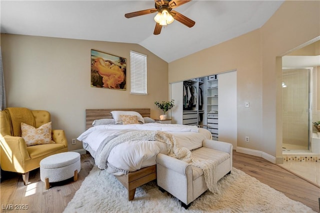 9333 Dry Dock Dr, Las Vegas, NV 89117 - bedroom featuring wood finished floors, vaulted ceiling, baseboards, a closet, and ceiling fan