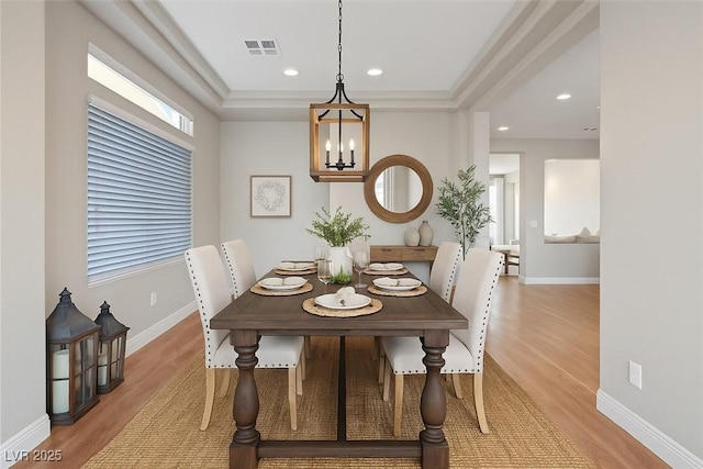 6056 Atlantis Dream Ave, Las Vegas, NV 89139 - dining room with light wood-style floors, recessed lighting, a chandelier, and a tray ceiling