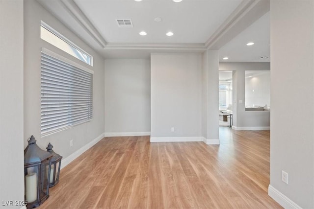 6056 Atlantis Dream Ave, Las Vegas, NV 89139 - empty room with light wood-style flooring, recessed lighting, and a tray ceiling