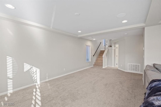 6056 Atlantis Dream Ave, Las Vegas, NV 89139 - unfurnished living room featuring carpet flooring, a raised ceiling, recessed lighting, and stairway