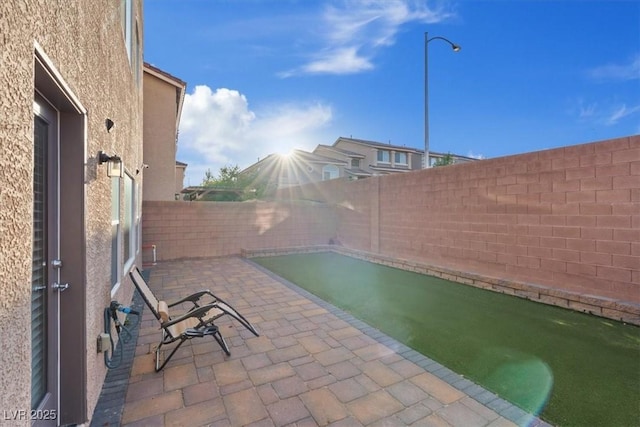 6056 Atlantis Dream Ave, Las Vegas, NV 89139 - fenced backyard with a patio area