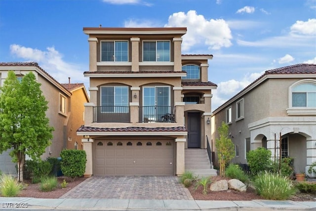 6056 Atlantis Dream Ave, Las Vegas, NV 89139 - view of front of house featuring stucco siding, a tile roof, driveway, and a garage