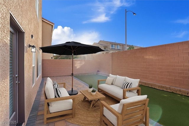 6056 Atlantis Dream Ave, Las Vegas, NV 89139 - fenced backyard with an outdoor hangout area and a patio area