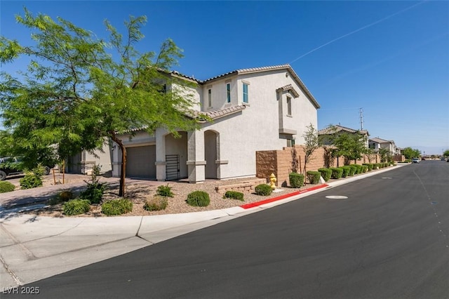 6442 Kobe Knoll Ct, Las Vegas, NV 89141 - view of front facade with stucco siding, a tiled roof, and an attached garage