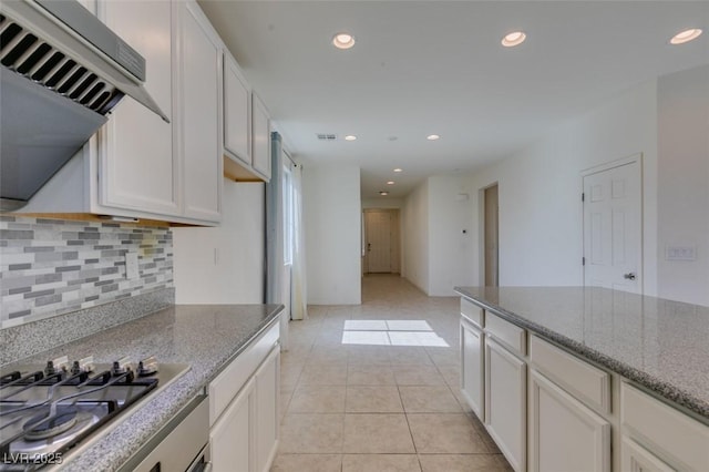 6442 Kobe Knoll Ct, Las Vegas, NV 89141 - kitchen with stainless steel gas stovetop, decorative backsplash, stone counters, ventilation hood, and recessed lighting