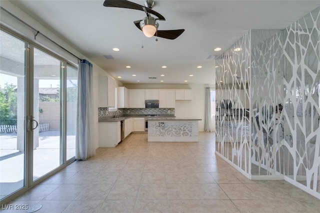 6442 Kobe Knoll Ct, Las Vegas, NV 89141 - kitchen featuring backsplash, white cabinets, a ceiling fan, stainless steel dishwasher, and recessed lighting