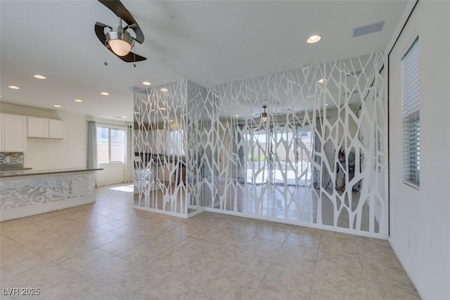 6442 Kobe Knoll Ct, Las Vegas, NV 89141 - unfurnished dining area featuring a ceiling fan, recessed lighting, and light tile patterned flooring