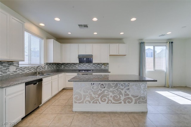 6442 Kobe Knoll Ct, Las Vegas, NV 89141 - kitchen featuring stainless steel dishwasher, recessed lighting, decorative backsplash, a center island, and white cabinetry