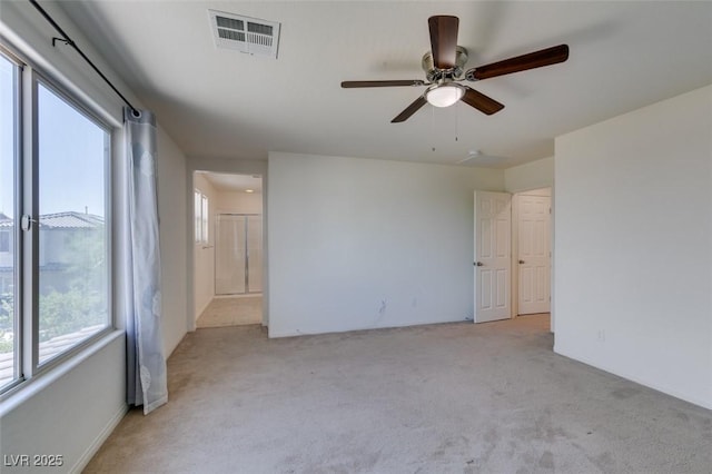 6442 Kobe Knoll Ct, Las Vegas, NV 89141 - spare room with healthy amount of natural light, light carpet, and a ceiling fan