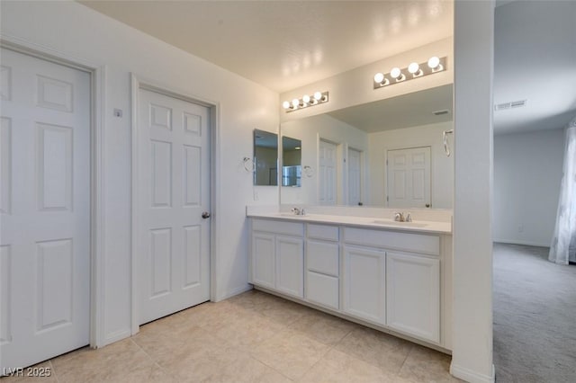 6442 Kobe Knoll Ct, Las Vegas, NV 89141 - bathroom featuring double vanity and tile patterned flooring