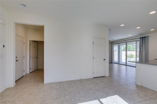 6442 Kobe Knoll Ct, Las Vegas, NV 89141 - empty room with recessed lighting and light tile patterned floors