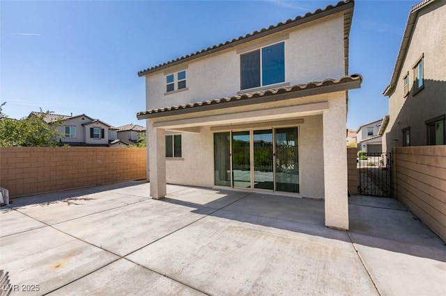 6442 Kobe Knoll Ct, Las Vegas, NV 89141 - back of property with a fenced backyard, stucco siding, a patio area, and a residential view