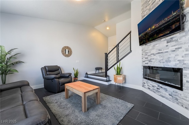 7288 Quarterhorse Ln, Las Vegas, NV 89148 - living area with lofted ceiling, a glass covered fireplace, and tile patterned floors
