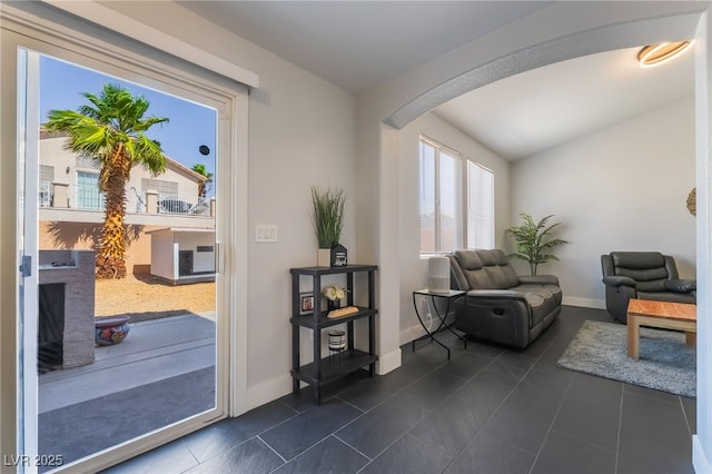 7288 Quarterhorse Ln, Las Vegas, NV 89148 - living area with arched walkways and dark tile patterned flooring