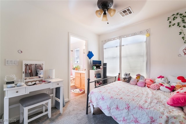 7288 Quarterhorse Ln, Las Vegas, NV 89148 - carpeted bedroom with connected bathroom and ceiling fan