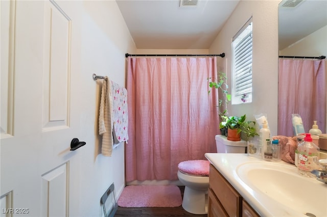 7288 Quarterhorse Ln, Las Vegas, NV 89148 - bathroom featuring vanity, a shower with curtain, and wood finished floors