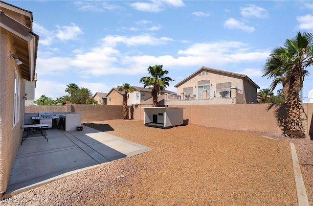 7288 Quarterhorse Ln, Las Vegas, NV 89148 - fenced backyard with a patio