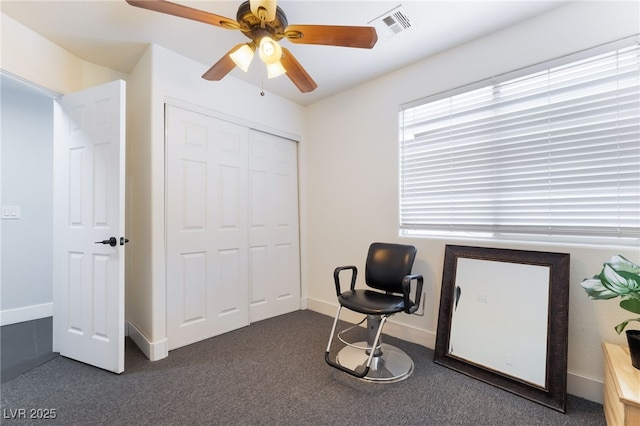 7288 Quarterhorse Ln, Las Vegas, NV 89148 - home office featuring a ceiling fan and dark colored carpet