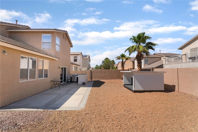 7288 Quarterhorse Ln, Las Vegas, NV 89148 - fenced backyard with a patio area, an outdoor structure, and a residential view