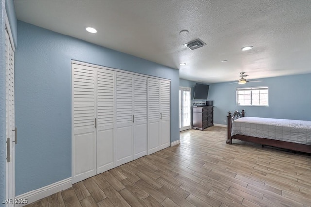 4428 Los Reyes Ct, Las Vegas, NV 89121 - bedroom with wood finished floors, baseboards, a textured ceiling, and recessed lighting