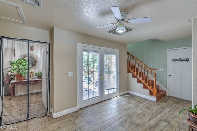 4428 Los Reyes Ct, Las Vegas, NV 89121 - foyer entrance with french doors, wood finish floors, a textured ceiling, ceiling fan, and baseboards