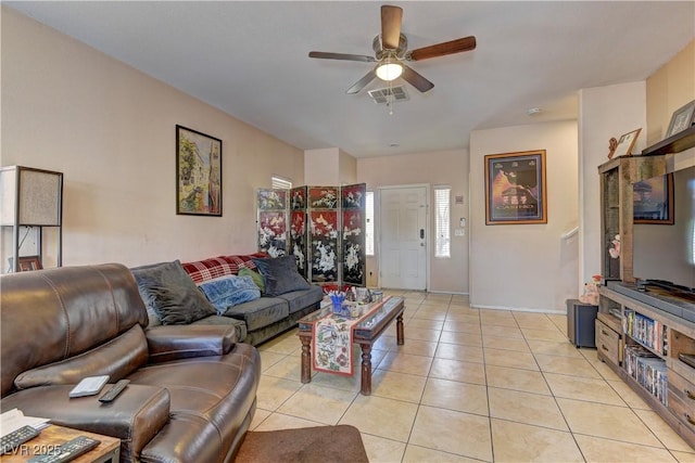 9091 Jumping Jacks Ave, Las Vegas, NV 89178 - living room with a ceiling fan, light tile patterned floors, and baseboards