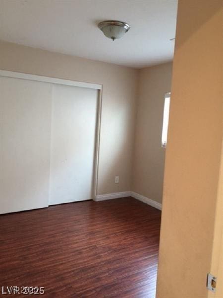 9091 Jumping Jacks Ave, Las Vegas, NV 89178 - unfurnished room featuring wood finished floors and baseboards