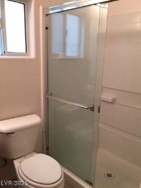 9091 Jumping Jacks Ave, Las Vegas, NV 89178 - bathroom with a shower stall and toilet